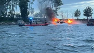 Captain arrested after boat bursts into flames forcing 22 passengers into water
