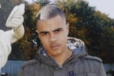 Son of man whose police death sparked 2011 riots charged with possessing a gun
