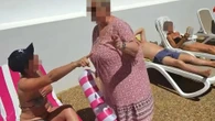 Watch moment tourist goes berserk as lady sits on sunbed she’s ‘using all week’