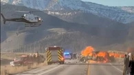Seven killed after tourist bus crashes and bursts into flames at national park