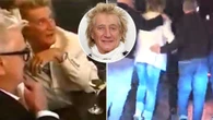 Sir Rod Stewart led to a car by minders after five hours of 'heavy boozing'