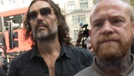 Russell Brand guarded by boxer pal of Tyson Fury as he appeared in court