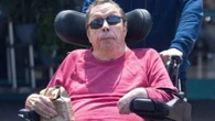 Tim Curry seen on rare outing with his carer 13 years after suffering a stroke