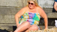 Gemma Collins hits the beach in strapless dress after fat jabs transformation