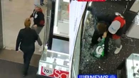 Moment have-a-go hero dad tackles hammer-wielding robber at shopping centre