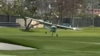 Moment plane barrels towards golfers after crashing at iconic country club