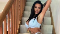 Katie Price shows off her shrinking frame as she poses on stairs in racy shoot