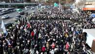 S.Korea president DODGES arrest as guards form human shield to stop cops