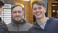 Humble Littler poses for photos with youngsters as he watches local youth team