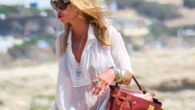 Kate Moss, 51, looks effortlessly glam as she takes £35k designer bag to BEACH