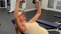 Pregnant Love Island star Arabella Chi shows off huge bump as she lifts weights