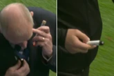 Referee forced to pause bitter derby as fans throw lighter and 'spirit bottle'
