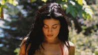 Kylie Jenner shows off curves in a red string bikini as she launches swim line