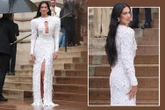 Dua Lipa shows off figure in feathered gown with revealing cutout