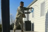 Shocking moment combat clad stalker pours ‘petrol’ outside woman's home