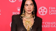 Dua Lipa flashes her thong as she goes braless in sheer dress