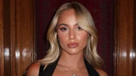 'World's most beautiful footballer' smoulders in plunging black dress