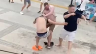 Party boat organiser plunges into sea as mass Brit tourist brawl erupts