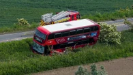 Driver dies after car and double-decker bus collide in crash on major road