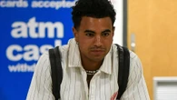 Love Island's Harrison arrives home in the UK after quitting the villa