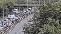 Oasis fans abandon cars and walk down hard shoulder after motorway crash