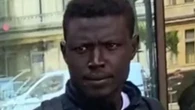 Homeless migrant who came to UK on dinghy denies spitting at cop