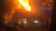 Moment explosion rips through Domino's store after fireball SUV hits building
