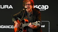 Legendary rocker looks worlds away from Live Aid - 40 years after iconic concert