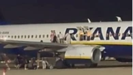 Passengers describe chaos as people jumped from plane wing during false alarm