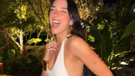 Dua Lipa ditches her underwear as she poses in revealing white dress