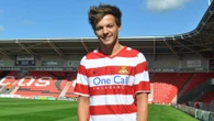 1D star Louis Tomlinson duped by fraudsters in a £4m footie plot