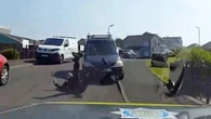 Moment cop is painfully thrown to ground by driver trying to flee police stop