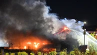 Sixty firefighters tackle huge blaze at tyre warehouse