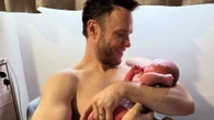 Olly Murs shares a peek at newborn son Albert as he cradles him in the hospital