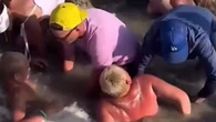 Moment kids get trapped in sinkhole as parents scream ‘get the lifeguard’