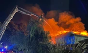 Huge blaze rips through football ground sending smoke billowing into sky