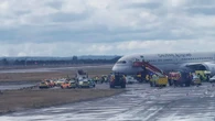 Cops storm Heathrow flight after passenger 'hit attendant & tried to open door'