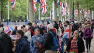 Thousands line Mall for VE Day parade with Royal Family to arrive