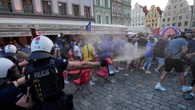 Shocking moment Chelsea fans brawl & throw glasses in Poland ahead of final