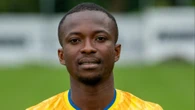 Footballer 'risks paralysis' after breaking neck in collision with hoarding