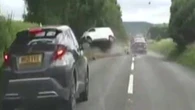 Moment 'worst driver ever seen' sends TWO cars flying during police chase
