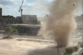 Terrifying moment 'dust DEVIL' rips through UK city centre