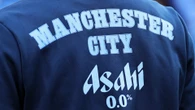 Man City REMOVE worker from Etihad after fans caught him wearing United top
