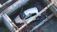 Teen dies after car 'plunged into sewage pit' as man & woman, 21, arrested