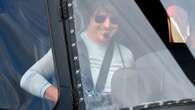 Tom Cruise is all smiles flying a helicopter onto the set of his new film