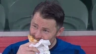 Sports ace eats KEBAB on bench after being subbed off during win over rivals