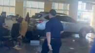 At least 8 injured as car plows into showroom in LA driven by angry customer