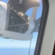 Horrifying moment plane panel comes off mid-air & flaps inches from propeller