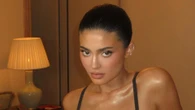 Kylie Jenner nearly busts out of tiny black bra and thong as she sips wine