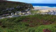 Mystery as young woman with red handbag found dead by cliffs in seaside town